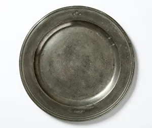 <b class=qtipBold><figcaption>Pewter plate</figcaption></b><br>Large pewter plate with a reeded edge, marked with the initials 'FHM' and various hallmarks, made in England before 1735. Date: pre 1735<br><em>© The Geffrye Museum of the Home / Mary Evans Picture Library</em> Pewter plate