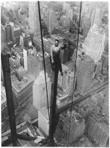 Prints of A dizzy perch 350 yards above street level: A New York workman (Carl Russell) engaged on the worlds tallest bulding (at the time), the Empire State Building United States Of America Prints: Empire State Building Print: A Dizzy Perch 350 Yards Above