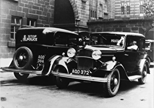 Police cars parked outside a station Police cars parked outside a station