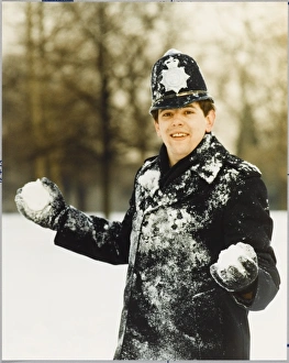 <b class=qtipBold><figcaption>Police Officer in Snow</figcaption></b><br>Police officer with two snowballs in winter covered in snow<br><em>© Mary Evans Picture Library</em> Police Officer in Snow