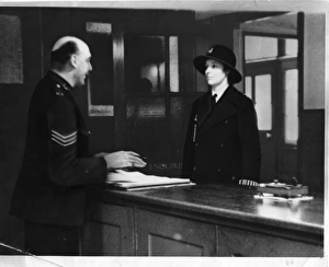 Two police officers in a police station, London Two police officers in a police station, London