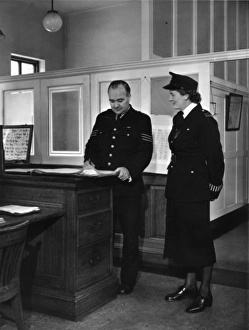Two police officers working in a station, London Two police officers working in a station, London