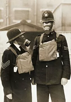 Policeman and policewoman with gas masks