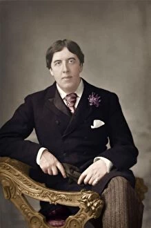 Colorised Gallery: Portrait of Oscar Wilde - Irish Playwright sitting in chair
