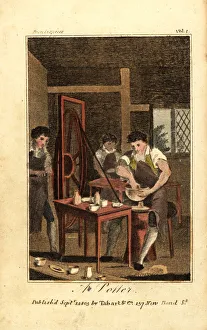 Potter making a clay vessel on a wheel driven Potter making a clay vessel on a wheel driven