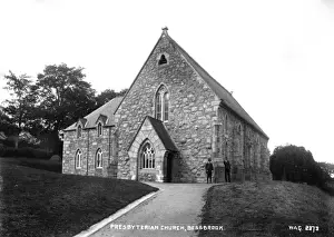 Prints of Presbyterian Church, Bessbrook - a front view of the Church and path up with two men standing outside. (Location: Northern Ireland; County Armagh; Bessbrook). Date: circa early 1900s County Armagh Prints: Early 1900s Bessbrook Presbyterian Church Print