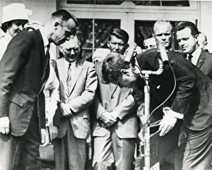 President John F. Kennedy stoops to retrieve the Nation? President John F. Kennedy stoops to retrieve the Nation?