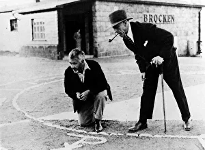 <b class=qtipBold><figcaption>Price, Joad at Brocken</figcaption></b><br>Harry Price (right) and Professor C E M Joad at the Brocken, Germany, June 1932, investigating the mountain's alledgedly magical features as part of the Brocken experiment<br><em>© Mary Evans Picture Library 2015 - https://copyrighthub.org/s0/hub1/creation/maryevans/MaryEvansPictureID/10197416</em> Price, Joad at Brocken