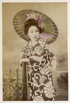<b class=qtipBold><figcaption>Racial/Japan/Geisha 1900</figcaption></b><br>A portrait of a geisha holding a parasol and characteristically made up with a pale face and red lips.<br><em>© Mary Evans Picture Library</em> Racial/Japan/Geisha 1900