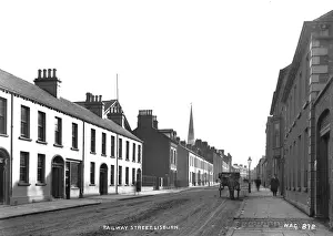 Prints of Railway Street, Lisburn - a street scene with horse vehicle and few people. (Location: Northern Ireland: County Antrim: Lisburn). Date: circa early 1900s Railway Prints: Early 20th Century Lisburn Railway Street Print