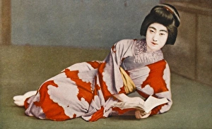 <b class=qtipBold><figcaption>Reclining Japanese girl reading</figcaption></b><br>A reclining Japanese geisha beauty reads from a text<br><em>© Mary Evans / Grenville Collins Postcard Collection</em> Reclining Japanese girl reading