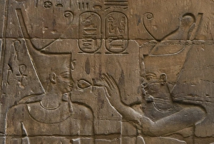Relief depicting Egyptian divinity giving the Ankh to a phar Relief depicting Egyptian divinity giving the Ankh to a phar