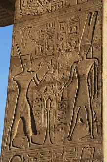 Relief depicting a Pharaoh making offerings to the god Amun Relief depicting a Pharaoh making offerings to the god Amun