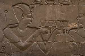 Relief depicting a pharaoh making offerings to the god MIN Relief depicting a pharaoh making offerings to the god MIN