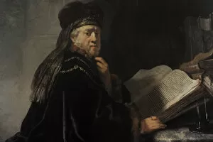 Rembrandt van Rijn (1606-1669). A Scholar in his study or A