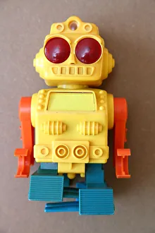 Robotic Gallery: Retro Toy Walking Plastic Robot - Yellow Body (1 / 3)