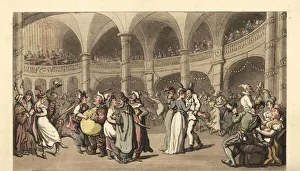 Revellers in costume at a masked ball in a large theater Revellers in costume at a masked ball in a large theater