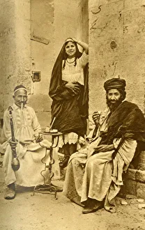 Rich man, dancing woman and beggar, Cairo, Egypt Rich man, dancing woman and beggar, Cairo, Egypt
