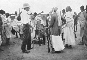 Richard Corfield distributing arms at Burao Fort
