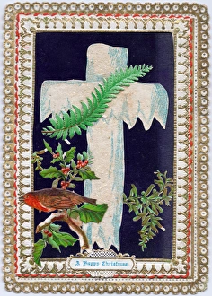 Robin, holly, mistletoe and a cross on a Christmas card Robin, holly, mistletoe and a cross on a Christmas card