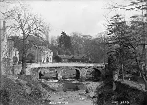 Prints of Rostrevor - a view of the stone arched bridge over the river near the Fairy Glen, there are buildings to the left. (Location: Northern Ireland; County Down; Rostrevor). Date: circa early 1900s River Prints: Early 20th Century Rostrevor Print