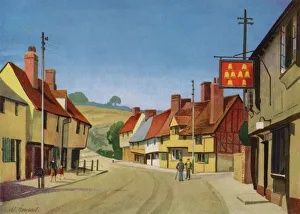 Saffron Walden in Essex, East Anglia, UK, showing a peaceful high street with half-timbered houses with pageting (decorated plaster work typical of the region) during the summer months. Saffron Walden was the centre of the crocus industry in Britain, producing saffron, hence the name Saffron Walden by Madge Howard