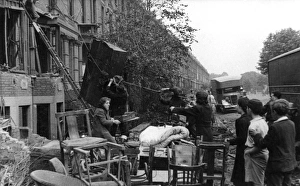 Salvaging furniture from damaged homes, London, WW2 Salvaging furniture from damaged homes, London, WW2
