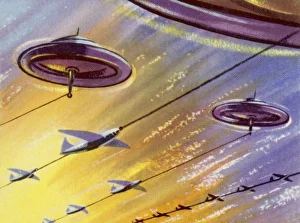 <b class=qtipBold><figcaption>Saucer and Rockets</figcaption></b><br>Train of Rockets Towed by a Flying Saucer<br><em>© Mary Evans Picture Library</em> Saucer and Rockets