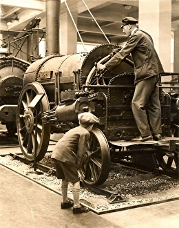 Schoolboy inspects the Rocket locomotive Schoolboy inspects the Rocket locomotive