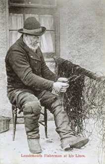 Scotland - Lossiemouth Fisherman mending his lines