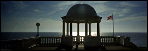 Seaside domed shelter with flag, Bexhill, England Seaside domed shelter with flag, Bexhill, England