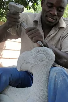 Related Images Gallery: Shona Sculpture - sculptor working on sculpture