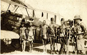 Shulluk warriors pose by Alan Cobham's aeroplane, Sudan Shulluk warriors pose by Alan Cobham's aeroplane, Sudan
