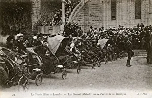 The sick in Bath chairs by the Basilica, Lourdes, France The sick in Bath chairs by the Basilica, Lourdes, France