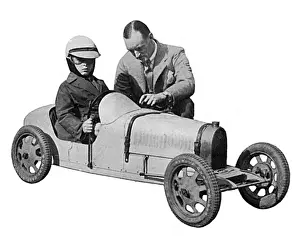 Donald Campbell Prints: Sir Malcolm Campbell & Donald Campbell in Toy Motor Car Print 1932