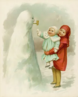 Sister holding up baby to see their snowman Sister holding up baby to see their snowman