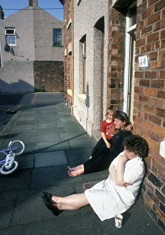 Sitting on the pavement outside a house in Barrow in Furness Sitting on the pavement outside a house in Barrow in Furness