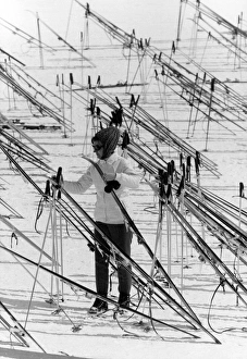 <b class=qtipBold><figcaption>Skis and Stick Patterns</figcaption></b><br>A skier amidst a pattern of skis and ski sticks at a resort in Switzerland. Date: 1960s<br><em>© Mary Evans Picture Library</em> Skis and Stick Patterns