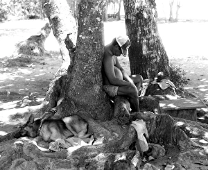 Sleeping man with dog, La Digue, Seychelles Sleeping man with dog, La Digue, Seychelles