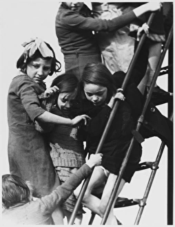 <b class=qtipBold><figcaption>Slide Queue</figcaption></b><br>A crush on the steps of a playground slide, as one little girl chickens out and decides to get off!<br><em>© Mary Evans Picture Library/MARGARET MONCK</em> Slide Queue