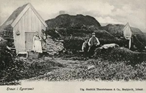 Small Icelandic Farmstead and owners - Iceland. Date: circa 1903 Small Icelandic Farmstead and owners - Iceland. Date: circa 1903