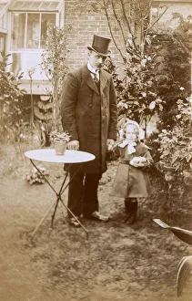 Smart Gentleman and young daughter in garden Smart Gentleman and young daughter in garden