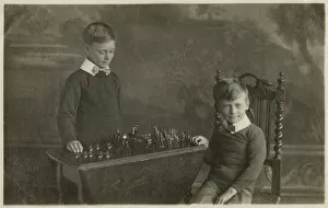 Matching Gallery: Two smart young boys play with their model tin soldiers