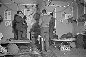 Darts Gallery: Four soldiers playing darts in an army hut