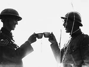 <b class=qtipBold><figcaption>Soldiers toast in 1917</figcaption></b><br>A French and a British Royal Garrison Artillery (RGA) sergeant toasting each other at Boesinghe in Belgium on the British front during World War I on 18th August 1917.<br><em>© Mary Evans/Robert Hunt Collection</em> Soldiers toast in 1917