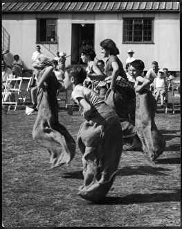 <b class=qtipBold><figcaption>Sports Day Sack Race 50S</figcaption></b><br>Boys and girls of various ages race against one another in the sack race.<br><em>© Mary Evans Picture Library/GERALD WILSON</em> Sports Day Sack Race 50S