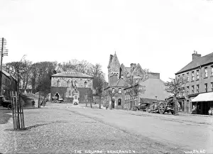 Prints of The Square, Dungannon - a view of the square with buildings and motor cars and horse vehicles. (Location: Northern Ireland; County Tyrone; Dungannon). Date: circa early 1900s Tyrone Prints: The Square, Dungannon Print: Early 20th Century Scene