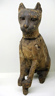 Statuette of a cat depicting goddess Bastet. Wood Statuette of a cat depicting goddess Bastet. Wood