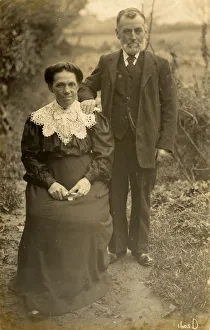 Stern elderly British couple pose for an outdoor portrait Stern elderly British couple pose for an outdoor portrait