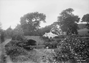 A stone arched bridge and building, Glenballyemon, Cushendal A stone arched bridge and building, Glenballyemon, Cushendal